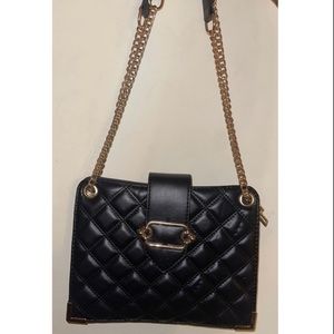 I am selling a black medium satchel/crossbody purse. brand new, never used.